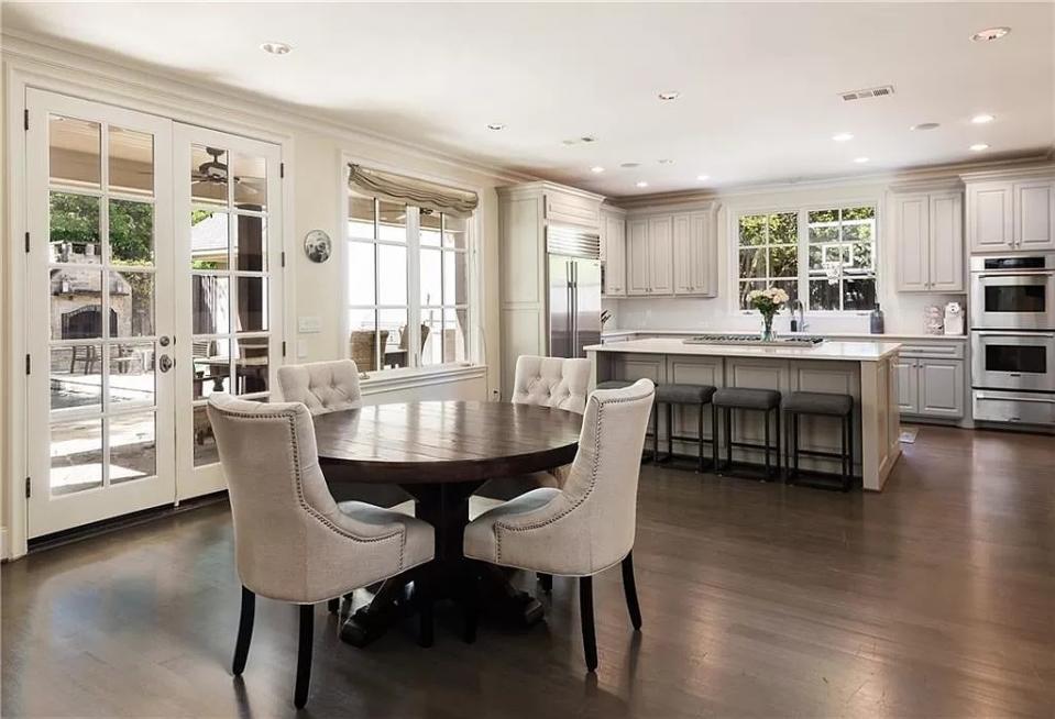 A view of the kitchen and breakfast space. Allie Beth Allman & Associates