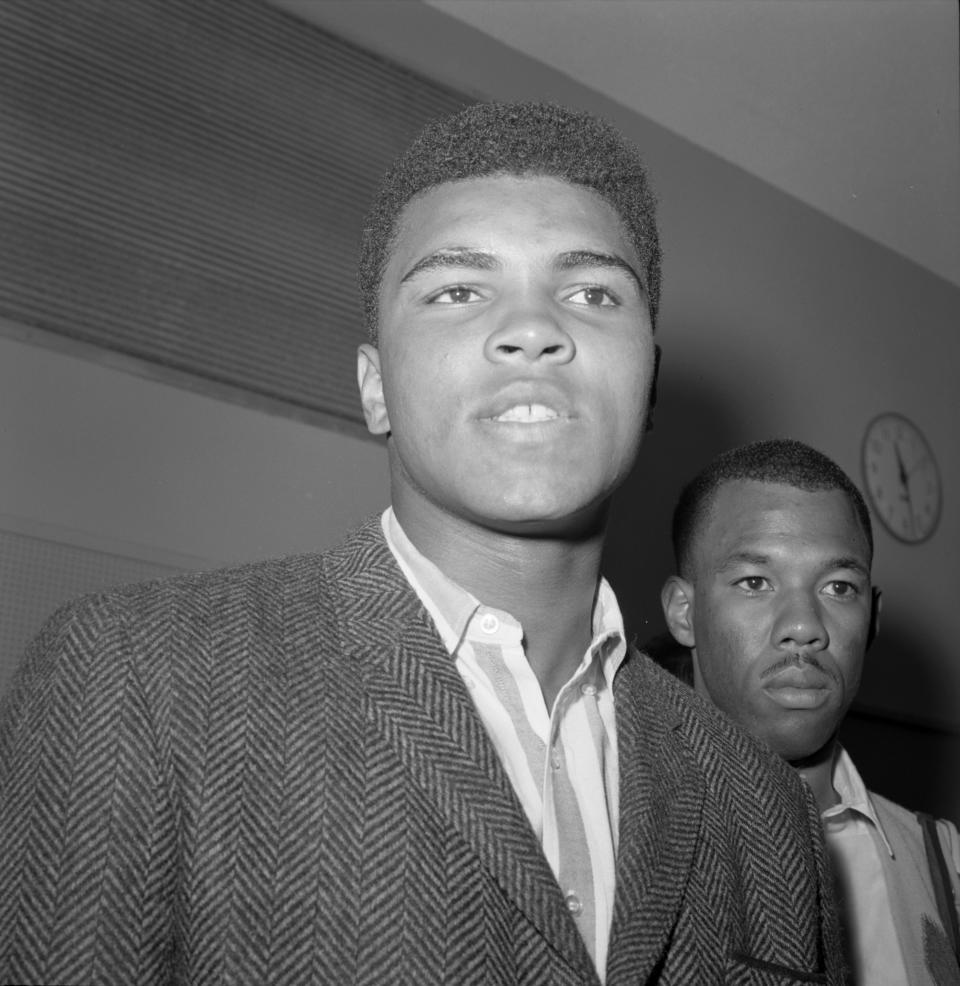 Muhammad Ali, left, and his friend, photographer Howard Bingham in 1964. (Photo: Getty Images).