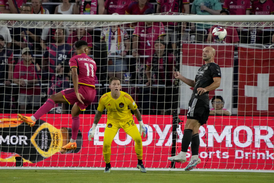 Houston Dynamo's Chase Gasper, right, clears the ball as Dynamo goalkeeper Steve Clark and St. Louis City's Nicholas Gioacchini (11) watch during the first half of an MLS soccer match Saturday, June 3, 2023, in St. Louis. (AP Photo/Jeff Roberson)