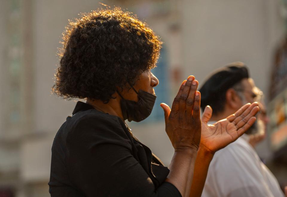 Dianna Miller claps during the Let's Turn It Around! community prayer on Sunday, June 12, 2022, at Jon R. Hunt Plaza in downtown South Bend.