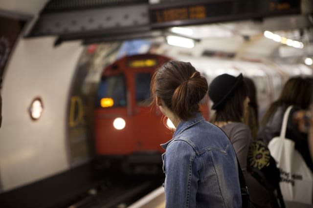 People waiting on London underground platform.