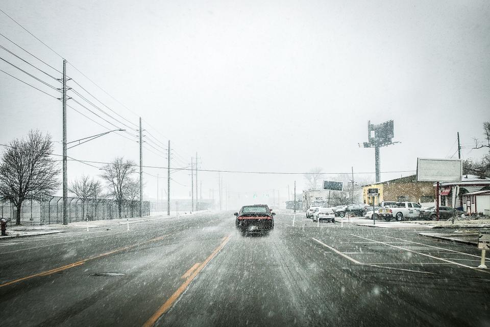 Roads start to get sloppy as drivers make their way through Highland Park, Mich. on Friday, Jan. 12, 2024. Forecasters are predicting up to 8 inches of snow to hit parts of southeast Michigan mostly on Friday.