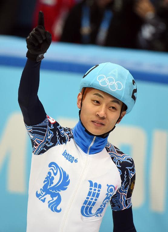 Russia's Victor Ahn celebrates after winning the gold medal in the Men's Short Track 500m final at the Iceberg Skating Palace during the Sochi Winter Olympics on February 21, 2014