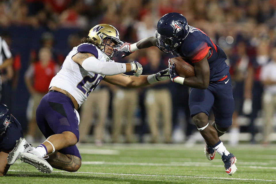 TUCSON, AZ - SEPTEMBER 24: Running back J.J. Taylor #23 of the Arizona Wildcats rushes the football against the Washington Huskies during the first quarter of the college football game at Arizona Stadium on September 24, 2016 in Tucson, Arizona. (Getty Images)