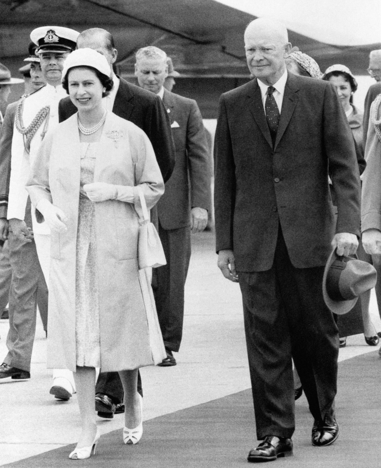 The Queen and President Dwight D. Eisenhower of America leaving the airstrip at St. Hubert, Quebec, where her Majesty greeted the President and his wife on their arrival in Canada.