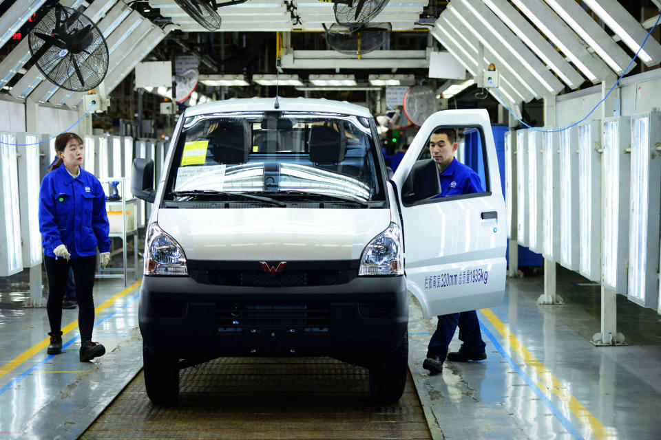 Workers inspect the finished vehicles in an SGMW subsidiary factory in Qingdao in east China's Shandong province Monday, April 29, 2019. SGMW is a joint venture between three automakers - SAIC Motor Corporation, Liuzhou Wuling Motors, and GM China. (Photo credit should read YU FANGPING / Barcroft Media via Getty Images)