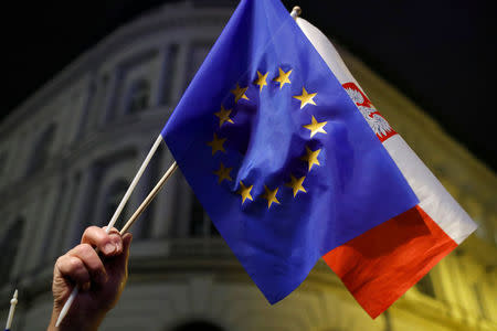 Polish and European Union flags are seen during a protest against judicial reforms in Warsaw, Poland, November 24, 2017. REUTERS/Kacper Pempel