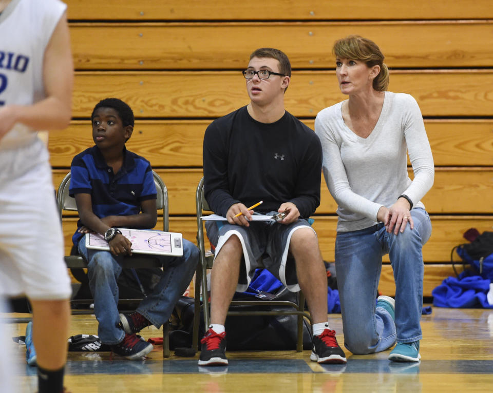 MT PLEASANT, SC - JANUARY, 25:  Debbie Antonelli keeps a close eye on the game with her son, Frankie Antonelli and Makia Brown, who are keeping stats during a scrimmage between the two Cario Middle School eighth grade boys teams on January 25, 2016 in Mt Pleasant, SC. (Jonathan Newton / The Washington Post via Getty Images)