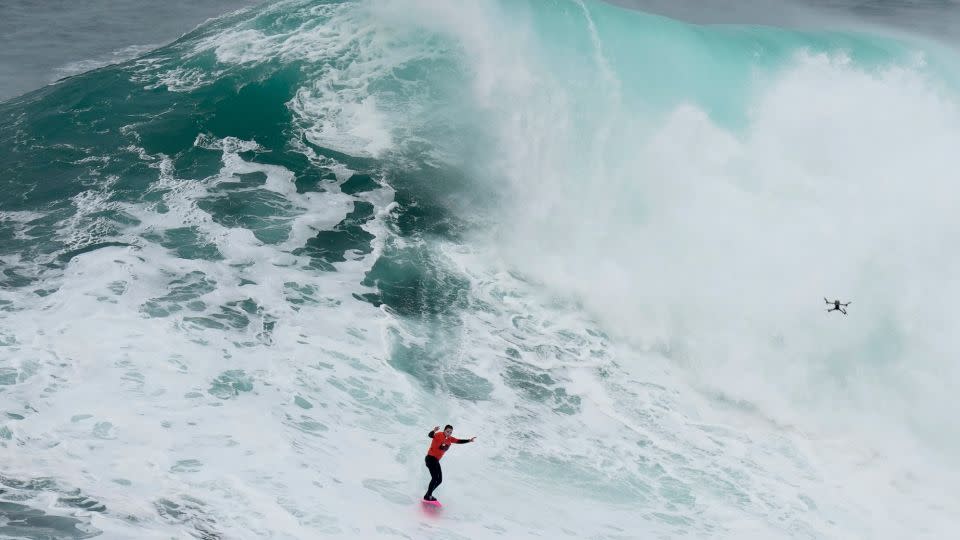 Maya Gabeira rides a wave during the Nazare Big Wave Challenge on Monday. - Armando Franca/AP