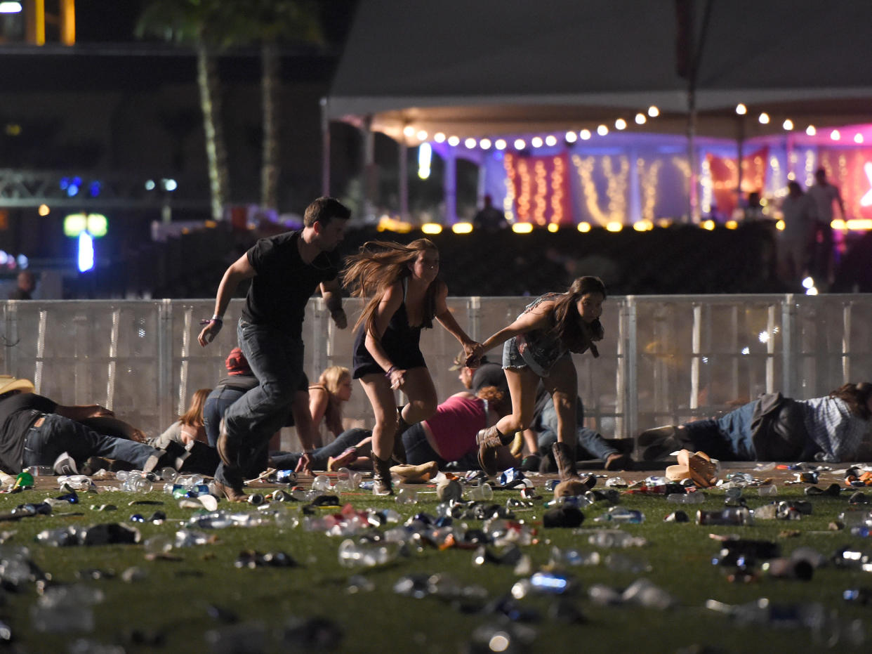 People run from the Route 91 Harvest country music festival in Las Vegas after a shooter opened fire: Getty Images