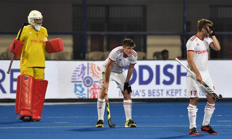 England defenders look dejected as they fell to semi-final defeat for the third hockey World Cup in a row.