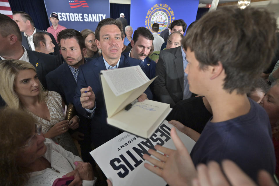 Florida Gov. Ron DeSantis, a Republican presidential candidate, greets supporters during a town hall event in Hollis, N.H., Tuesday, June 27, 2023. (AP Photo/Josh Reynolds)