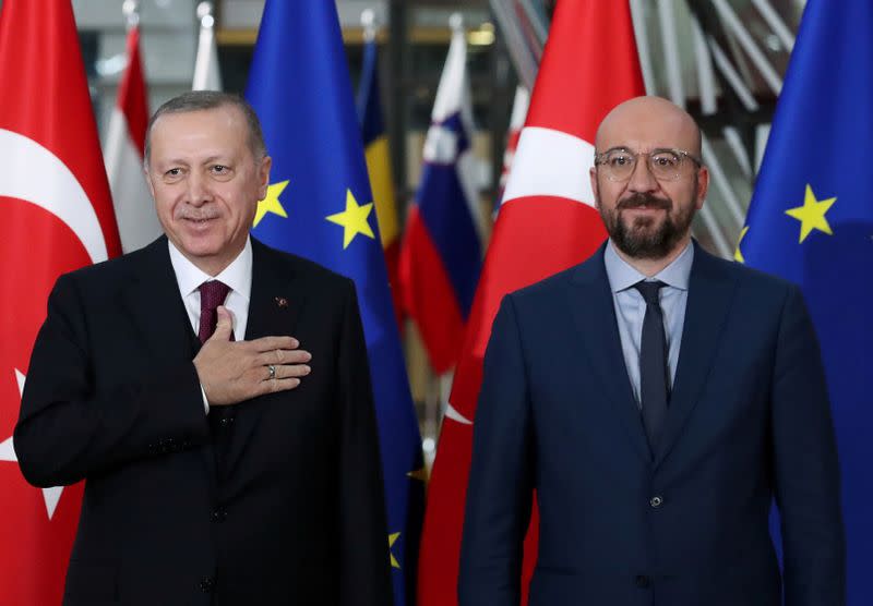 FILE PHOTO: Turkish President Tayyip Erdogan and EU Council President Charles Michel pose in Brussels