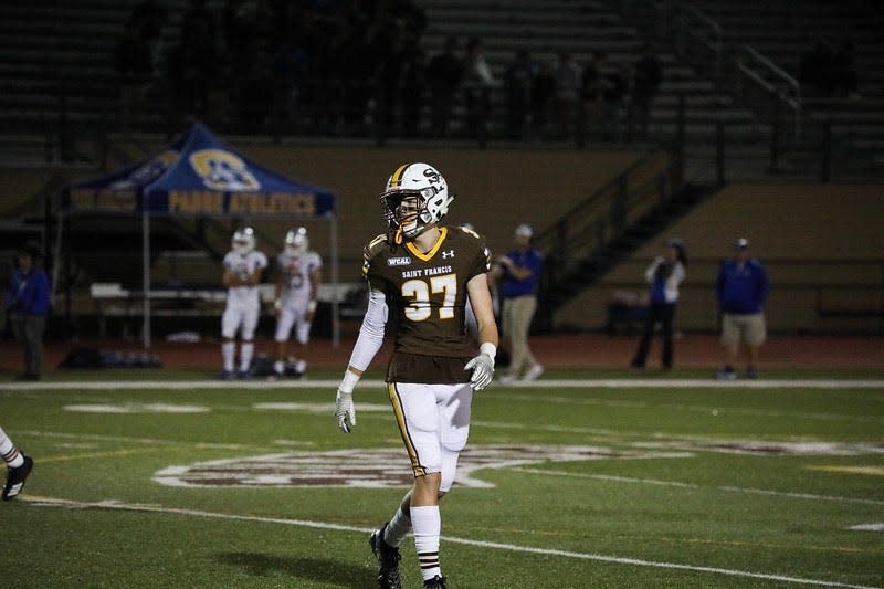Pictured is Holden Hughes playing football at Saint Francis High School in Mountain View, California.