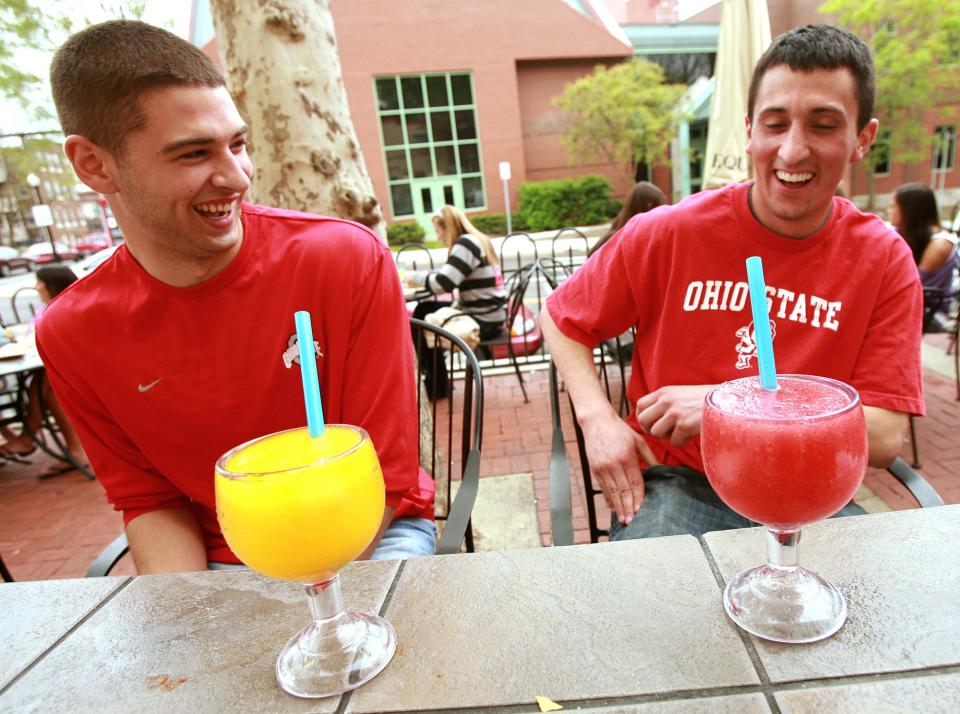 Two Ohio State students enjoy jumbo margarita's at Cazuelas.