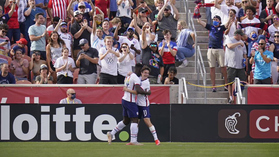 United States' Daryl Dike (24) receives a hug from Brenden Aaronson (11) after scoring against Costa Rica during the first half during an international friendly soccer match Wednesday, June 9, 2021, in Sandy, Utah. (AP Photo/Rick Bowmer)