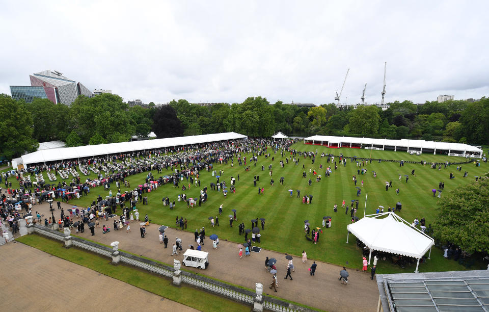 LONDON, ENGLAND - MAY 29: Guests gather on the lawn during the Queen's Garden Party at Buckingham Palace on May 29, 2019 in London, England. (Photo by Stuart C. Wilson - WPA Pool/Getty Images)