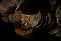 A a block of encrusted silver coins from the shipwreck of a 1804 galleon, on its first display to the media at a ministry building, in Madrid, Friday, Nov. 30, 2012. Spanish cultural officials have allowed the first peep at 16 tons (14.5 metric tons) of the shipwreck, 'Nuestra Senora de las Mercedes' a treasure worth an estimated $500 million that a U.S. salvage company gave up after a five-year international ownership dispute. (AP Photo/Daniel Ochoa de Olza)