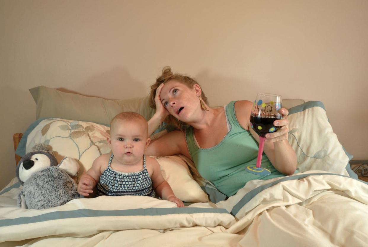 <span class="caption">A wine mom is a mother who drinks wine to take the edge off daily tasks associated with motherhood.</span> <span class="attribution"><span class="source">(Shutterstock)</span></span>