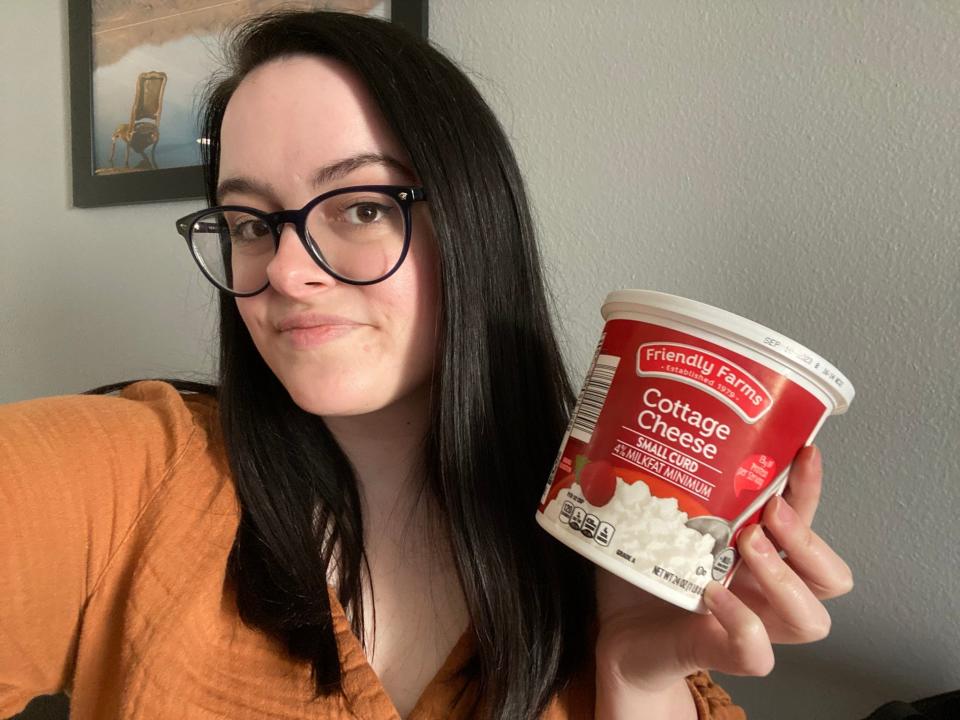 Selfie of the writer holding Friendly Farms cottage cheese
