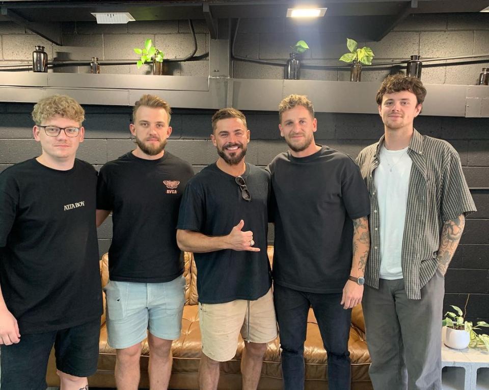 Zac posed with the boys who worked at Atta Boy Hair. Photo: Instagram/Atta Boy Hair