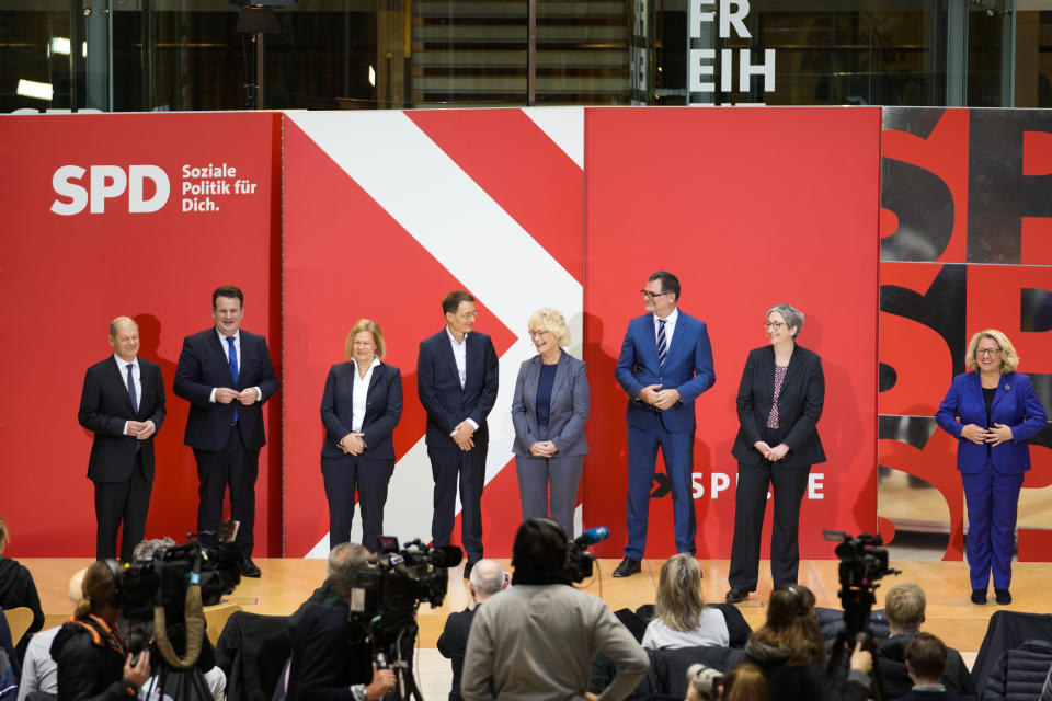 Designated German new chancellor Olaf Scholz, left, presents the ministers of his Social Democratic Party, SPD, during a news conference at the party's headquarters in Berlin, Germany, Monday, Dec. 6, 2021. German parliament Bundestag is planning to elect Olaf Scholz for chancellor on Wednesday, Dec. 8, 2021. From left to right: Designated Chancellor Olaf Scholz and the designated ministers Hubertus Heil, for Labour and Social Affairs, Nancy Faeser for Interior, Karl Lauterbach for Health, Christine Lambrecht for Defence, Wolfgang Schmidt head of the Chancellery, Klara Geywitz for Construction and Svenja Schulze for Economic Cooperation and Development. (AP Photo/Markus Schreiber)