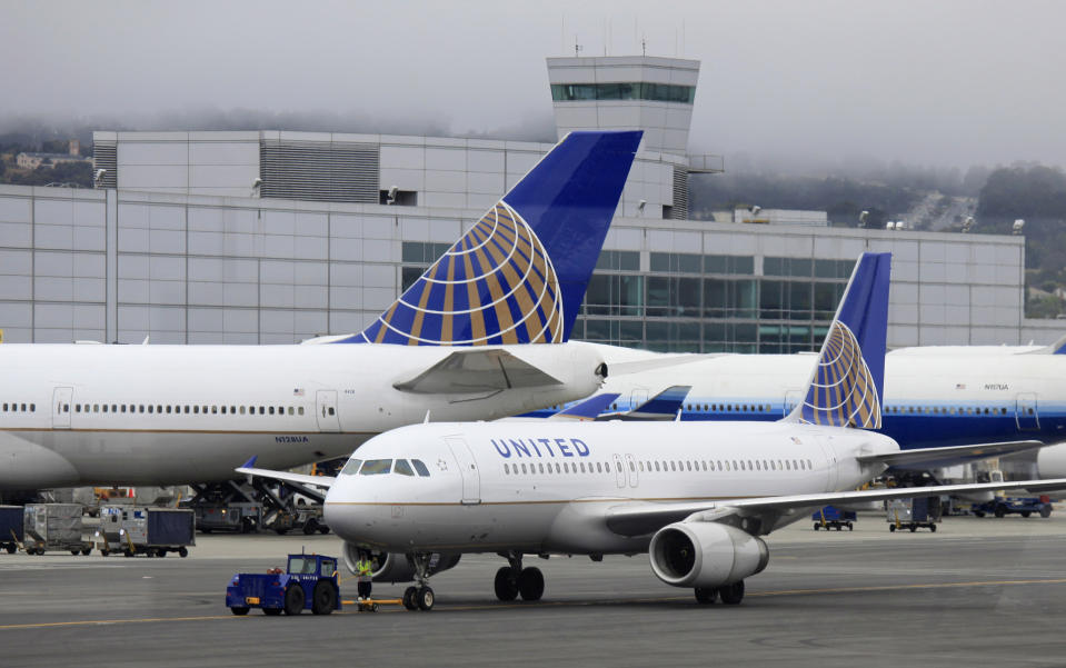 FILE - In this July 13, 2011 file photo, United Airlines planes sit on the tarmac at San Francisco International Airport in San Francisco. Thousands of United Airlines passengers around the globe were delayed for hours Thursday, Nov. 15, 2012 after another massive computer outage hit the world’s largest carrier. This is at least the third major computer outage for the Chicago-based airline since June. (AP Photo/Eric Risberg, File)