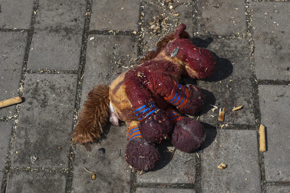 A stuffed horse with bloodstains on it lies on a platform after Russian shelling at the railway station in Kramatorsk, Ukraine, Friday, April 8, 2022. Hours after warning that Ukraine's forces already had found worse scenes of brutality in a settlement north of Kyiv, President Volodymyr Zelenskyy said that “thousands” of people were at the station in Kramatorsk, a city in the eastern Donetsk region, when it was hit by a missile. (AP Photo/Andriy Andriyenko)
