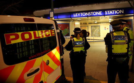 Police officers investigate a crime scene at Leytonstone underground station in east London, Britain December 6, 2015. REUTERS/Neil Hall