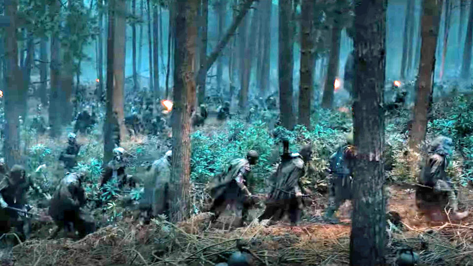 An army of orcs make their way through a forest in The Rings of Power season 2