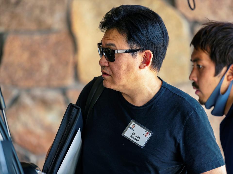 Mickey Mikitani arrives at Sun Valley wearing sunglasses