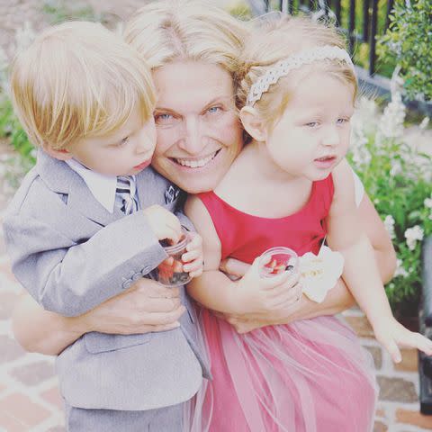 <p>Tosca Musk Instagram</p> Tosca Musk smiling with her children, son Grayson and daughter Isabeau.