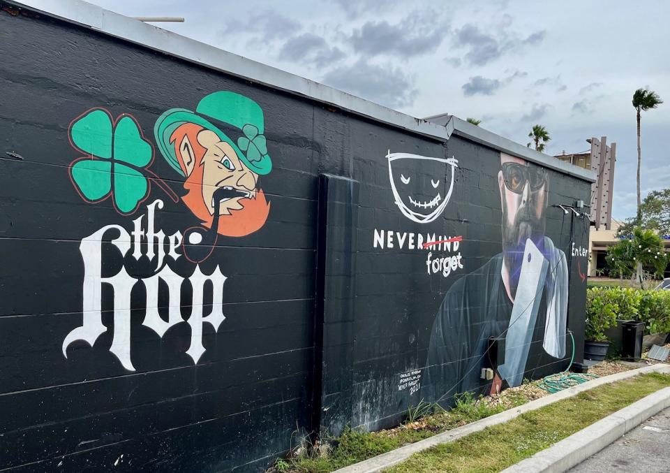 A mural of Shannon Yates covers an exterior wall of Nevermind Awesome Bar & Eatery in Cape Coral.