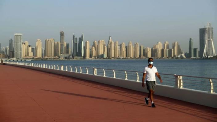 A man walks in Dubai.
