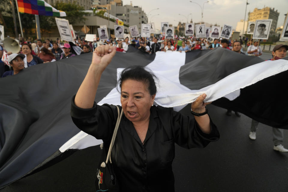 FILE - Demonstrators march against Peruvian President Dina Boluarte in Lima, Peru, Thursday, Jan. 12, 2023. Human rights groups, including the United Nations, have called on the Peruvian government to investigate claims of excessive force used by police and soldiers during recent protests that have left 49 civilians dead, and the autopsies provide some evidence of the alleged use of lethal ammunition. (AP Photo/Martin Mejia, File)