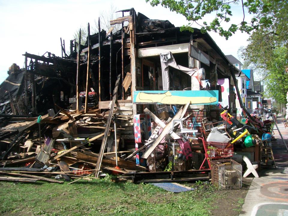 The "OJ" structure was set on fire deliberately in the early morning hours of Friday, May 3, 2013, at Detroit's Heidelberg Project.