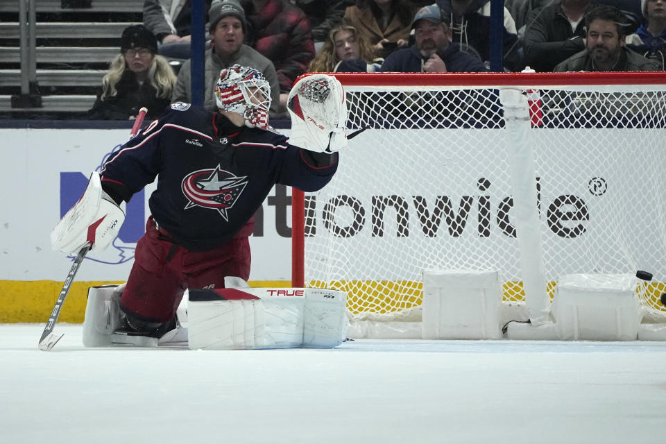 A snapshot by Los Angeles Kings' Drew Doughty gets past Columbus Blue Jackets goaltender Elvis Merzlikins in overtime of an NHL hockey game, Tuesday, Dec. 5, 2023, in Columbus, Ohio. (AP Photo/Sue Ogrocki)