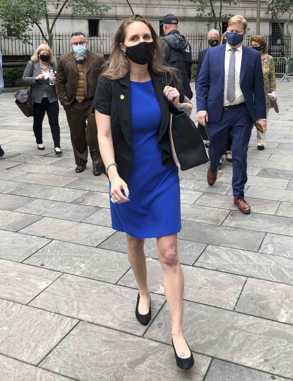 Natalie Mayflower Sours Edwards, center, leaves court after receiving a six-month prison sentence for leaking confidential financial reports to a journalist at Buzzfeed, Thursday June 3, 2021, in New York. (AP Photo/Larry Neumeister)