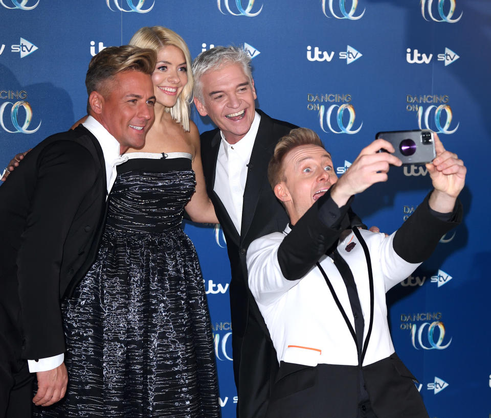 Matt Evers, Holly Willoughby, Phillip Schofield and Ian Watkins during the Dancing On Ice 2019 photocall at the Dancing On Ice Studio, ITV Studios, Old Bovingdon Airfield on December 09, 2019 in Bovingdon, England. (Photo by Karwai Tang/WireImage)