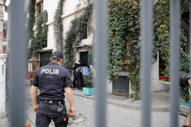 Turkish police officers stand outisde the home office of James Le Mesurier, founder of the Mayday Rescue group, in Istanbul