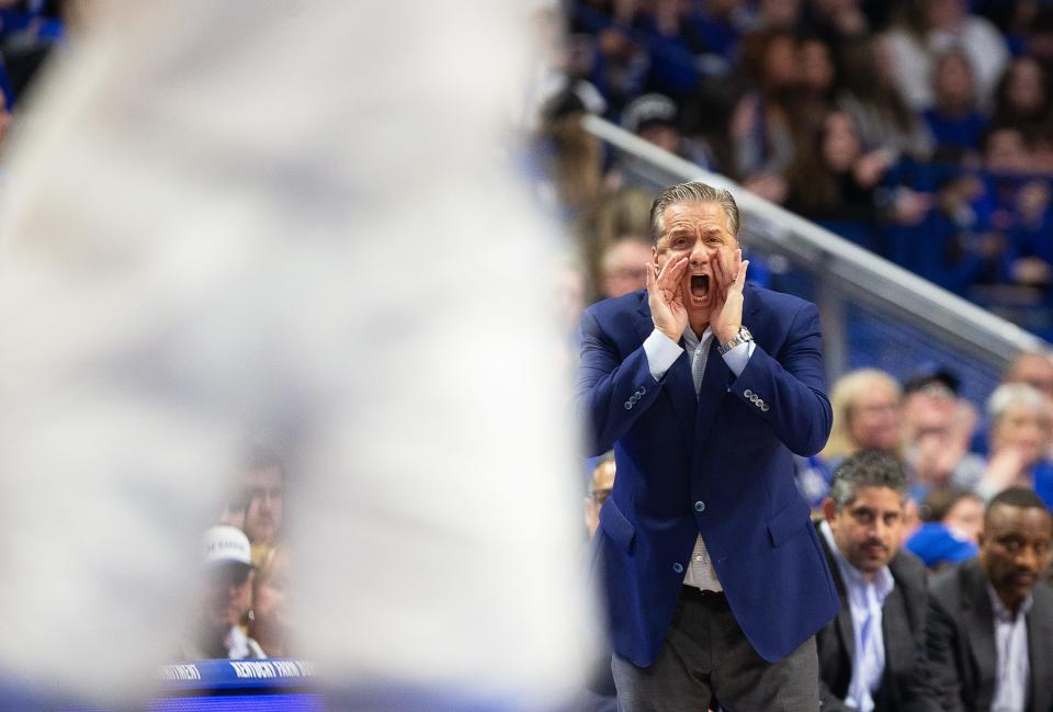 Kentucky coach John Calipari shouts to his team during an SEC game against Florida. The host Wildcats lost in overtime Wednesday night.