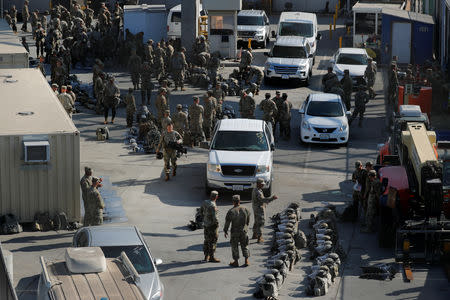 FILE PHOTO: U.S. Military troops prepare for deployment with U.S. Customs and Border Protection agents during a large-scale operational readiness exercise at the San Ysidro port of entry with Mexico in San Diego, California, U.S., January 10, 2019. REUTERS/Mike Blake/File Photo