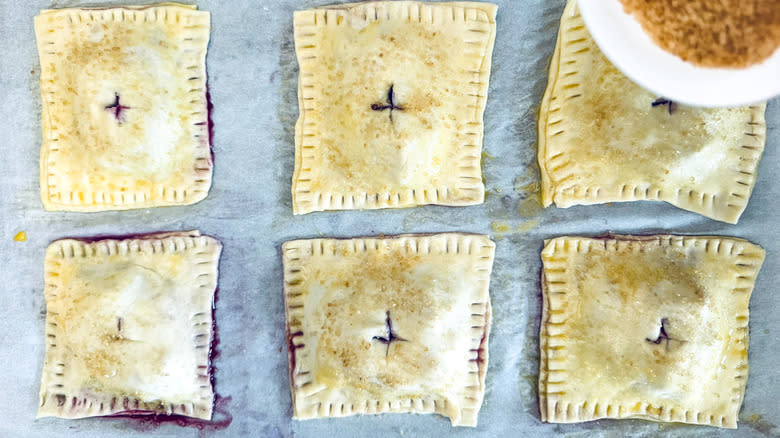 sugar sprinkled onto hand pies