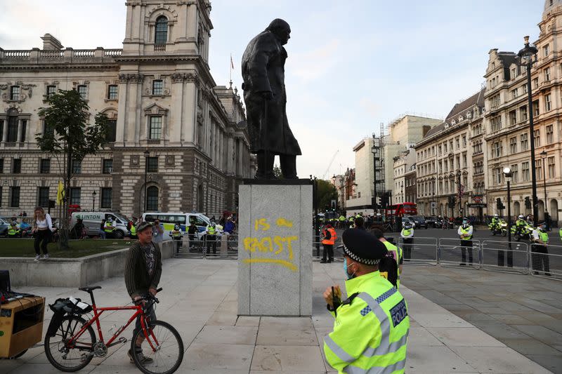 FILE PHOTO: A graffiti is seen on the statue of Winston Churchill, in London