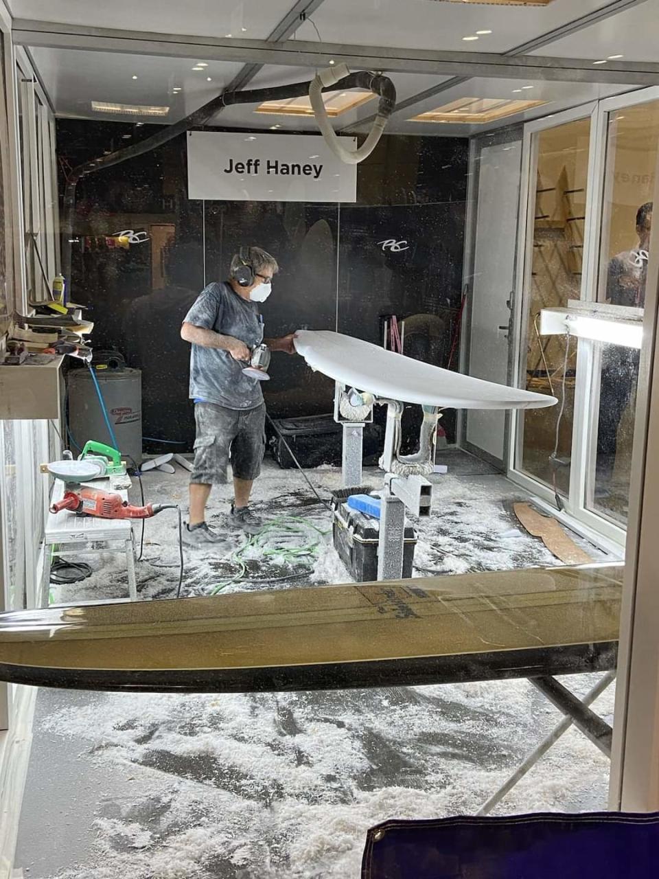 Jeff Haney shapes a surfboard during the 2023 Surf Expo in Orlando.