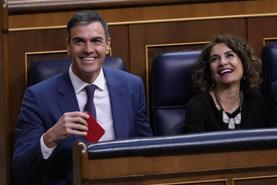 Spain's Socialist Prime Minister Pedro Sanchez, left, and Spain's Deputy Prime Minister and Ministry of Finance Maria Jesus Montero at the Spanish Parliament in Madrid, Spain, Thursday, March 14, 2024. Prime Minister Pedro Sánchez has promoted the amnesty as a way to move past a secession attempt by the then-leaders of Catalonia, a northeastern region centered around Barcelona where many speak the local Catalan language as well as Spanish. (AP Photo/Manu Fernandez)