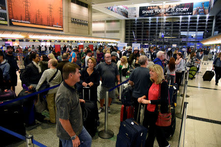 FILE PHOTO: Thanksgiving holiday travelers queue inside Tom Bradley International Terminal at Los Angeles International Airport in Los Angeles, California, U.S. November 23, 2016. REUTERS/Bob Riha Jr./File Photo