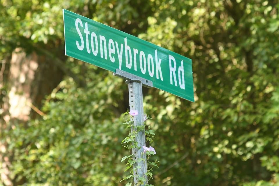 Stoneybrook Road in Ogden Wednesday Aug. 10, 2022. Ogden residents have asked New Hanover County to step in to improve the condition of an "orphan road" in their neighborhood. The residents along Stoneybrook Road will pay the county to bring the road's condition up to state standards, so it can be taken over by NCDOT. Orphan roads occur when developers don't maintain roads built within their communities. KEN BLEVINS/STARNEWS