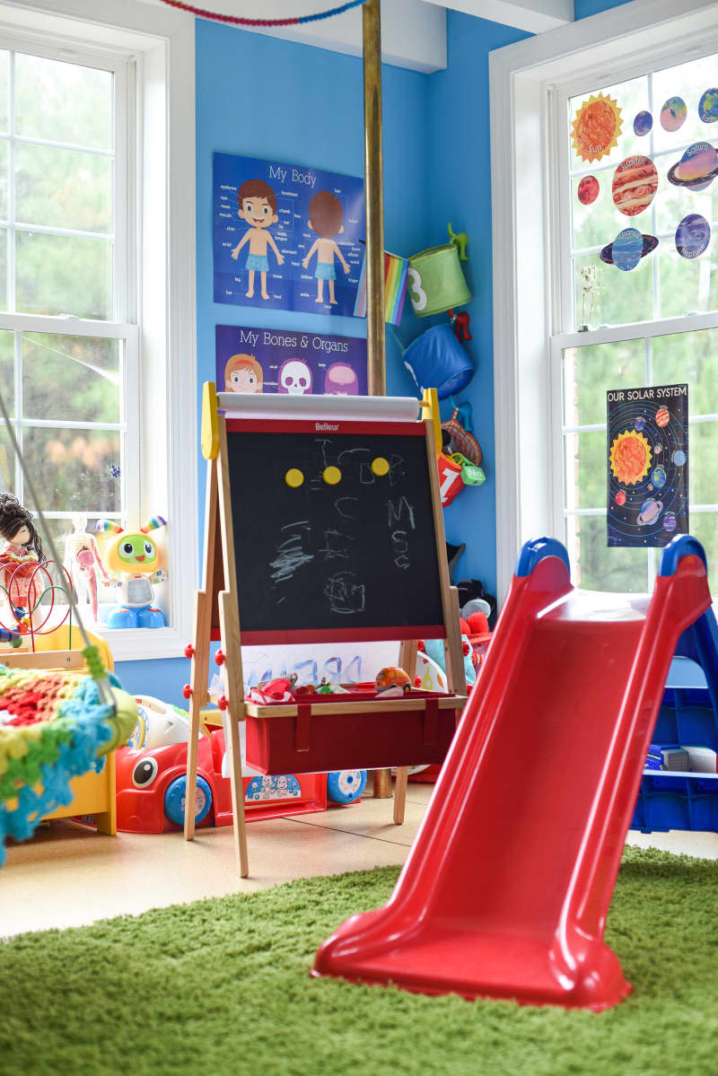 Red slide in kids room.