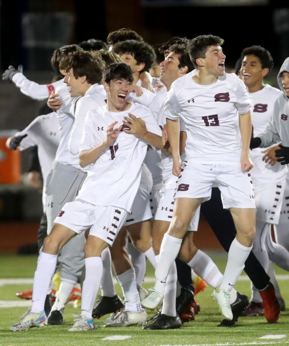 Scarsdale celebrates after defeating McQuaid Jesuit 2-0 in the New York State Class AA Soccer Championship at Middletown High School Nov. 13, 2022. 